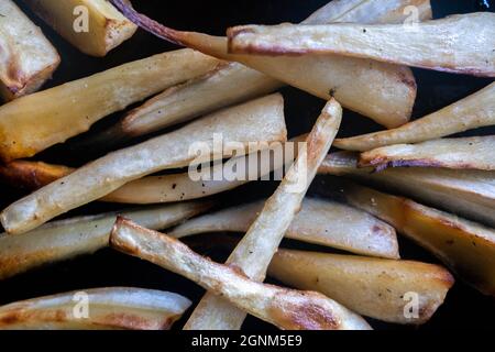 Baking Tray Of Homecooked Fresh Roast Parsnips With No People Stock Photo