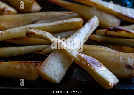 Baking Tray Of Homecooked Fresh Roast Parsnips With No People Stock Photo