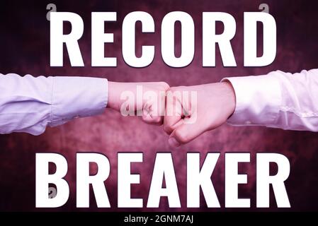 Hand writing sign Record Breaker. Business concept someone or something that beats previous best result Two Professional Well-Dressed Corporate Stock Photo