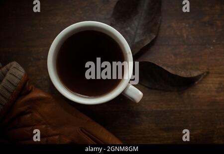 closeup photo of cup of black coffee on a rustic table Stock Photo