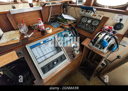 Lindesnes, Norway - July 10 2008: Interior and instruments of a wheelhouse in an old trawler. Stock Photo