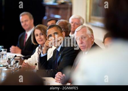 President Barack Obama meets with the Democratic House Caucus in the East Room of the White House, June 2, 2011. Flanking the President are Minority Leader Nancy Pelosi, left, and Rep. Steny Hoyer, Minority Whip. (Official White House Photo by Pete Souza) This official White House photograph is being made available only for publication by news organizations and/or for personal use printing by the subject(s) of the photograph. The photograph may not be manipulated in any way and may not be used in commercial or political materials, advertisements, emails, products, promotions that in any way su Stock Photo