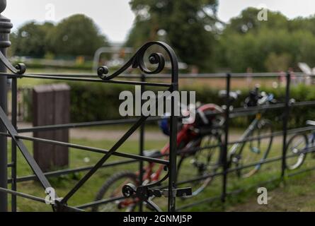 Black wrought iron gate that is open Stock Photo