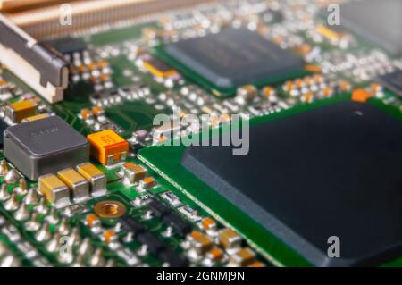 electronic circuit board with passive and active circuit components and IC close-up Stock Photo