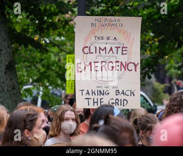 Halifax, Canada. September 24, 2021. March through the streets part of Student-led strike for climate actions. Sign this is emergency calling for NS Stock Photo