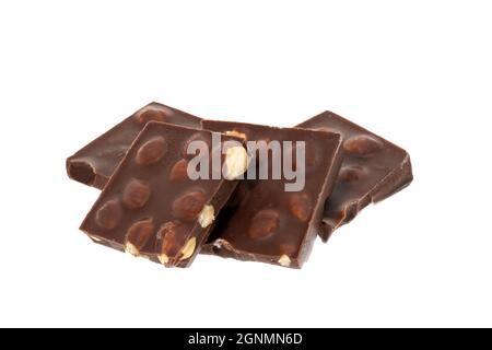 Slices of milk chocolate with hazelnuts - white background Stock Photo