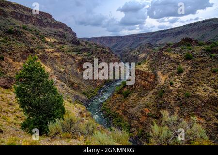 Stunning view of the Rio Grande Gorge in New Mexico as a storm rises in the distance Stock Photo