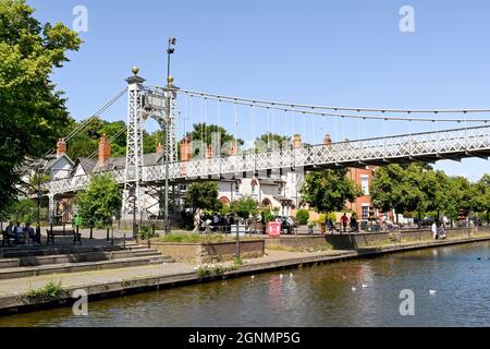 Chester, England - July 2021: Queens Park Bridge 1923 suspension footbridge over the River Dee in Chester. Stock Photo