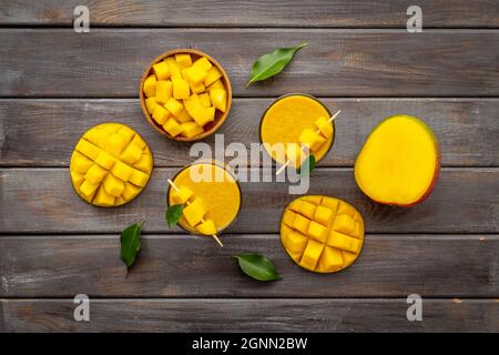 Top view of mango slices and cubes with fresh mango smoothie Stock Photo