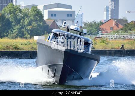 Marell M15 patrol boat undertaking hard and fast maneuvering in Royal Victoria Dock in London as part of DSEI 2021 event Stock Photo