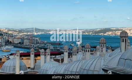 Istanbul, Turkey - September 2021: Istanbul skyline as seen from Suleymaniye Mosque. Istanbul cityscape through mosque domes. Old versus new istanbul Stock Photo