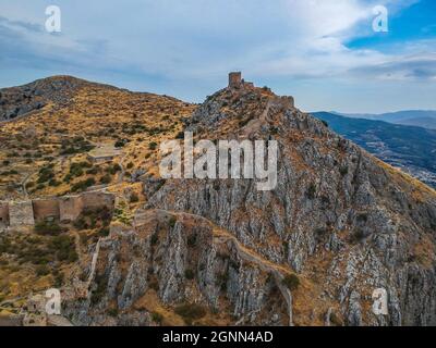 Aerial view of Acrocorinth 'Upper Corinth' the acropolis of ancient Corinth, Greece. It is a monolithic rock overseeing the ancient city of Corinth an Stock Photo