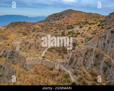 Aerial view of Acrocorinth 'Upper Corinth' the acropolis of ancient Corinth, Greece. It is a monolithic rock overseeing the ancient city of Corinth an Stock Photo