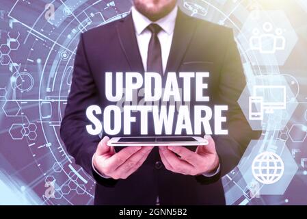 Conceptual caption Update Software. Word for replacing program with a newer version of same product Man In Office Uniform Holding Tablet Displaying Stock Photo