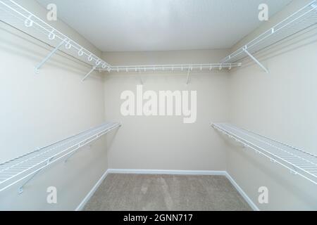 Empty wire shelving storage in an empty closet Stock Photo