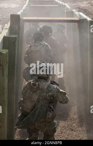 Soldiers from 1st Battalion, 8th Infantry Regiment, 3rd Armored Brigade Combat Team, 4th Infantry Division advance through a trench during a platoon live fire exercise, Sept. 10, 2021 at Fort Carson, Colo. (U.S. Army photo by Capt. Tobias Cukale) Stock Photo