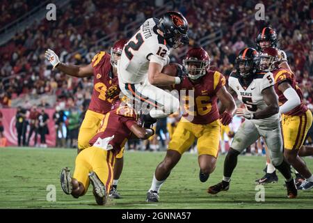 Oregon State Beavers linebacker Jack Colletto (12) is tackled by Southern California Trojans safety Isaiah Pola-Mao (21) during a NCAA football game, Stock Photo