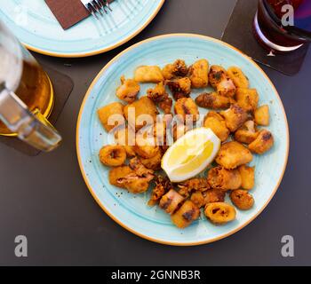 Spanish seafood dish battered fried baby squid Stock Photo