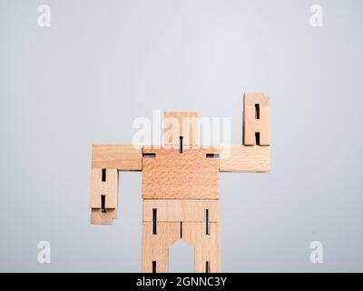 Leadership concept. The Leader or influencer, wooden robot strong power gesture standing isolated on white background, minimal style. Stock Photo