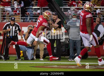 Santa Clara, CA, USA. 26th Sep, 2021. Green Bay Packers' AJ Dillon (28) is  tackled by San Francisco 49ers' Azeez Al-Shaair (51) and San Francisco 49ers'  Emmanuel Moseley (4) after a pass