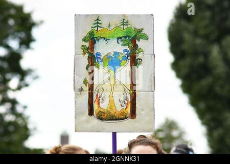 Heidelberg, Germany - 24th September 2021: Sign with hourglass painting at Global Climate Strike demonstration Stock Photo