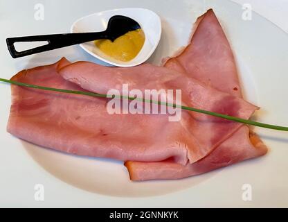 Dish of Prague Ham with Dijon mustard. Italian cuisine Stock Photo