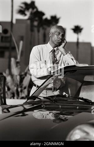 An African American businessman on his cell phone in Los Angeles, CA MR - model released Stock Photo