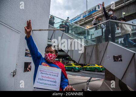 Bangkok, Thailand. 26th Sep, 2021. A man dressed as superman with protesters make three finger salute during the demonstration.Pro-democracy protesters gathered at the Bangkok Art and Culture Center (BACC) on September 26, 2021 to mark the 1st anniversary of political movement in Thailand that led by United Front of Thammasat and Demonstration (UFTD) demanding the resignation of Prayut Chan-O-Cha and the monarchy reform. (Photo by Peerapon Boonyakiat/SOPA Image/Sipa USA) Credit: Sipa USA/Alamy Live News Stock Photo
