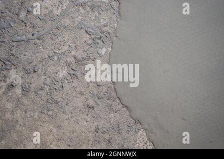 floor partially covering with self-levelling cement mortar Stock Photo