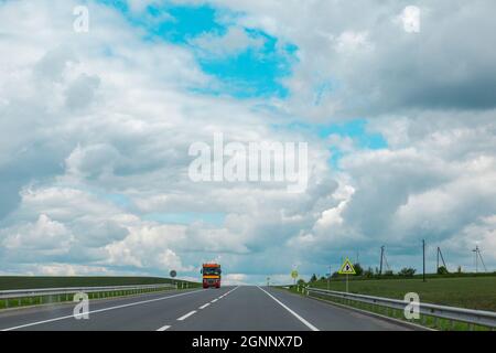 truck on speedway sunny summertime day copy space Stock Photo