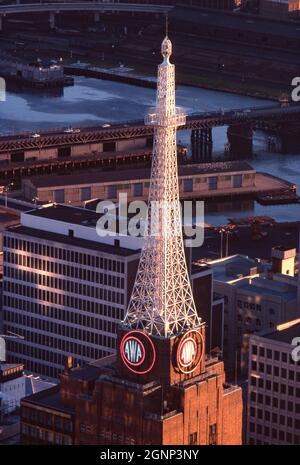 The AWA Tower, York Street, Sydney, NSW, Australia – a late afternoon view from Centrepoint (Sydney) Tower in 1981 when the Pyrmont Bridge (background) was still carrying motor traffic over Cockle Bay in Darling Harbour. The AWA Tower is a heritage-listed office and communications complex in Sydney, NSW, Australia built for Amalgamated Wireless Australasia Limited. The AWA Tower consists of a radio transmission tower atop a 15-storey building – a vintage 1980s photograph. Stock Photo