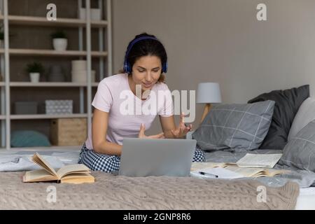 Caucasian female student have webcam lesson at home Stock Photo
