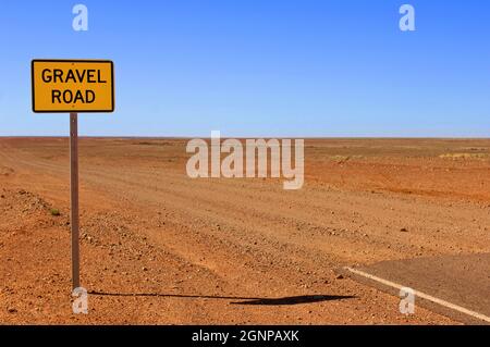 End of a paved road and beginning of a gravel road, Australia, Oodnadatta Stock Photo