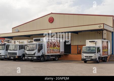 Manacor, Spain; september 25 2021: Main facade of the hen egg company Avicola Ballester with delivery trucks parked at the entrance in the Majorcan to Stock Photo