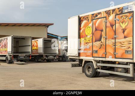 Manacor, Spain; september 25 2021: Main facade of the hen egg company Avicola Ballester with delivery trucks parked at the entrance in the Majorcan to Stock Photo