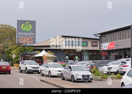 Cars queued and parked outside a Woolworths Supermarket at Harris Park in western Sydney, New South Wales, Australia Stock Photo