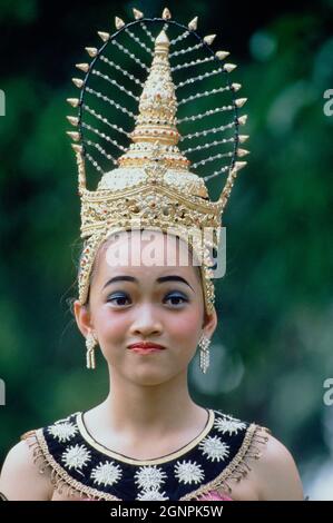 Thailand. Sukhothai. Loy Krathong festival. Outdoors portrait of young woman wearing headdress. Stock Photo