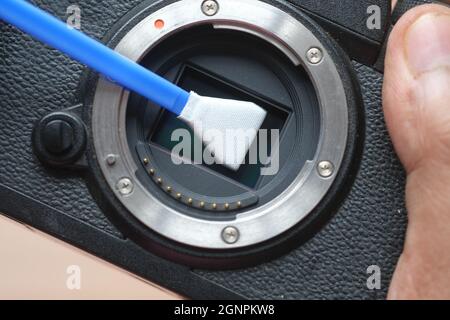 close up of cleaning camera sensor, Stock Photo