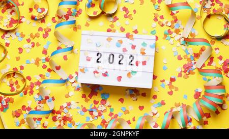 new year 2022 party celebration flat lay with confetti and streamers Stock Photo