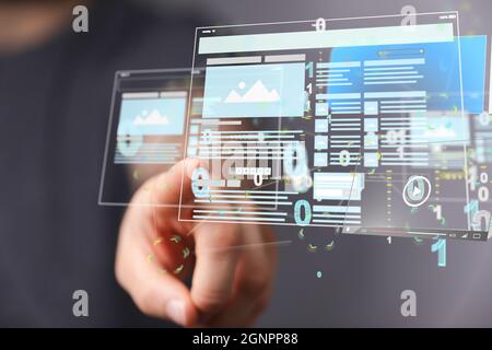 Close up shot on a finger interacting with the 3d develop interface web application Stock Photo