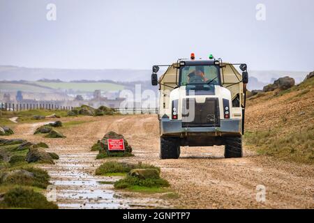 Articulated Dump Truck with load of shingle aggregate Stock Photo