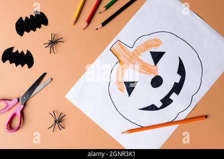 Halloween decoration with stationery on orange color background Stock Photo