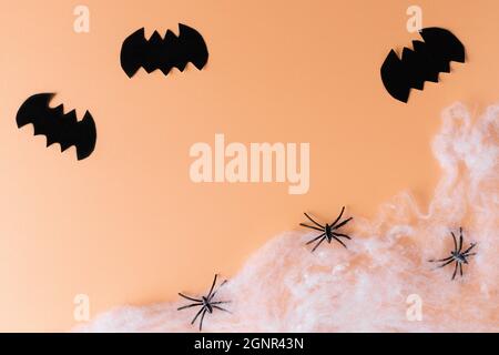 Creative scary composition with paper bats, spiders and spider web Stock Photo