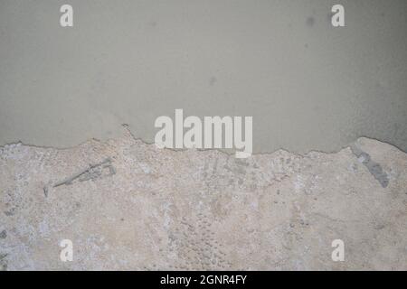 floor partially covering with self-levelling cement mortar Stock Photo