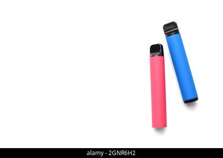 Two electronic cigarettes on a white background. Place for your text. Stock Photo