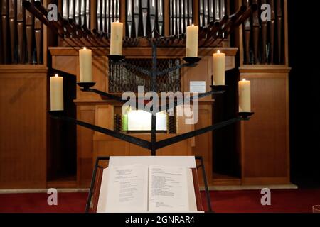 Saint Francois de Sales basilica.  Catholic masss. Open Gospel book, church candels and pipe organ.  Thonon. France. Stock Photo