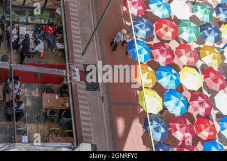 Ankara, Turkey. 27th Sep, 2021. People seen walking under the umbrellas at Konur street.One of the busiest streets of Ankara, Konur street, umbrellas were hung by the municipality teams for decoration purposes. (Photo by Tunahan Turhan/SOPA Images/Sipa USA) Credit: Sipa USA/Alamy Live News Stock Photo