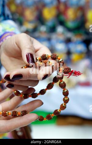 Rudraksha Rosary In A Female Hand. Japa Mala Stock Photo, Picture