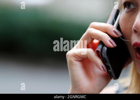 Woman using a smartphone.  Italy. Stock Photo
