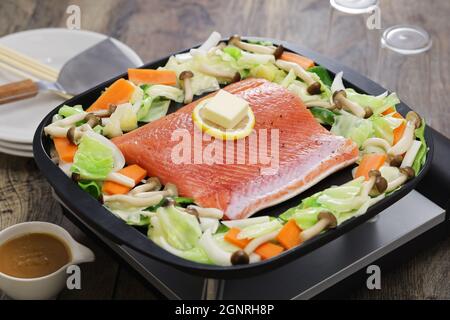 Japanese cooking; Hokkaido style salmon chanchan yaki, stir fried salmon and vegetables, seasoned with miso sauce. Stock Photo
